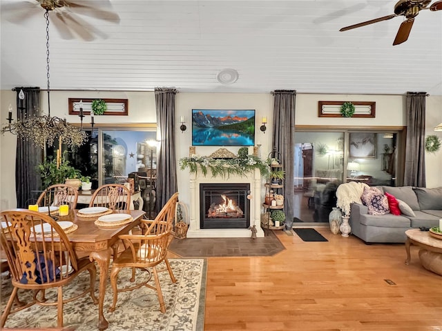 dining area with hardwood / wood-style flooring and ceiling fan