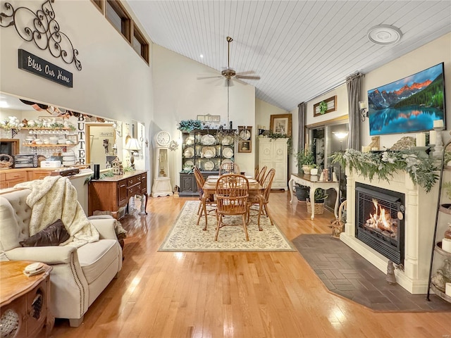 dining room featuring wood ceiling, ceiling fan, high vaulted ceiling, and hardwood / wood-style floors