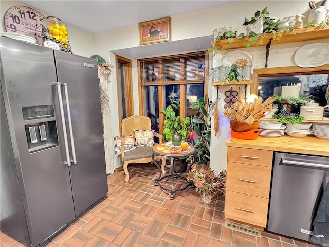 kitchen featuring high quality fridge