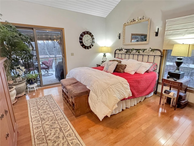 bedroom with lofted ceiling, wood ceiling, access to outside, and wood-type flooring