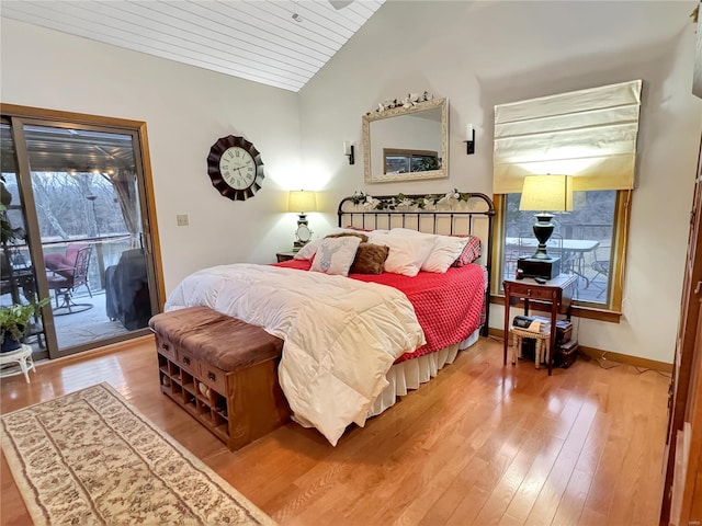 bedroom with wooden ceiling, lofted ceiling, hardwood / wood-style floors, and access to outside