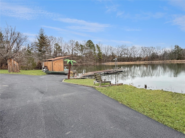 exterior space with a yard and a water view