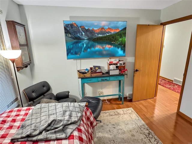 bedroom with hardwood / wood-style floors