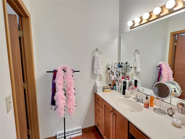 bathroom featuring vanity and hardwood / wood-style floors