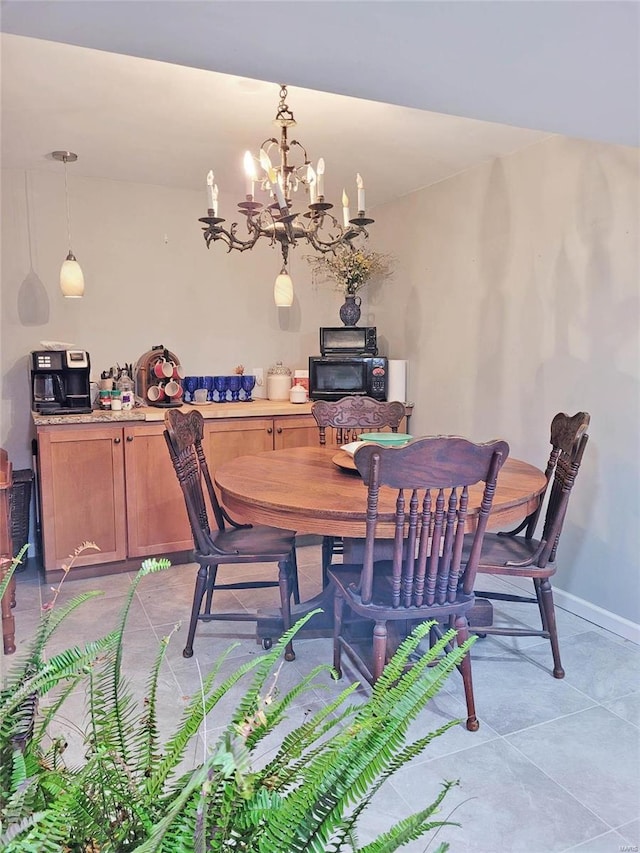 dining area with an inviting chandelier