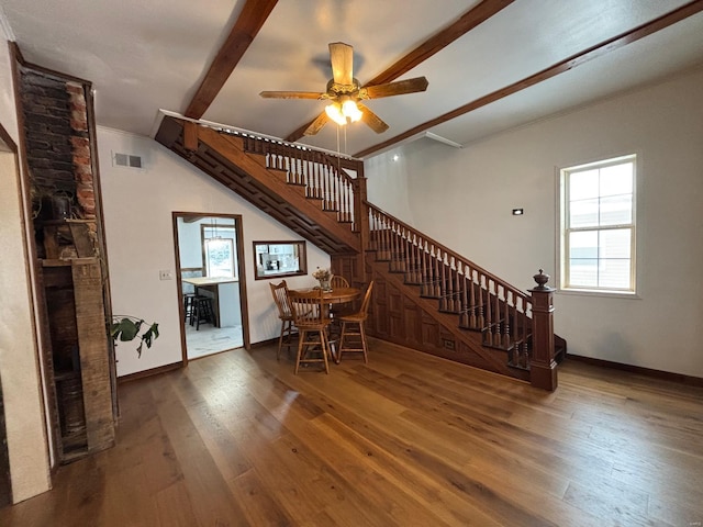 interior space featuring crown molding, ceiling fan, dark hardwood / wood-style floors, and beam ceiling