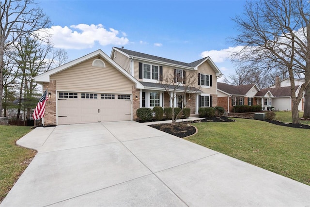 traditional-style home featuring a garage, a front yard, brick siding, and driveway