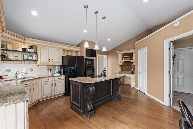 kitchen with lofted ceiling, black appliances, cream cabinetry, decorative backsplash, and open shelves