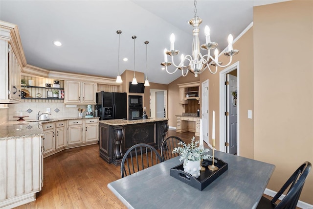 dining room featuring recessed lighting, ornamental molding, vaulted ceiling, wood finished floors, and baseboards