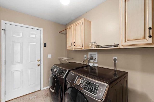 laundry area featuring cabinet space, independent washer and dryer, and baseboards