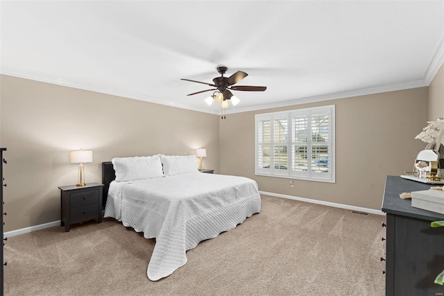 bedroom featuring baseboards, ceiling fan, crown molding, and light colored carpet