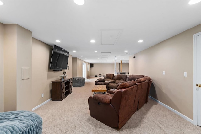 carpeted living area featuring recessed lighting and baseboards