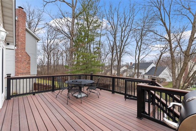 wooden terrace with outdoor dining space