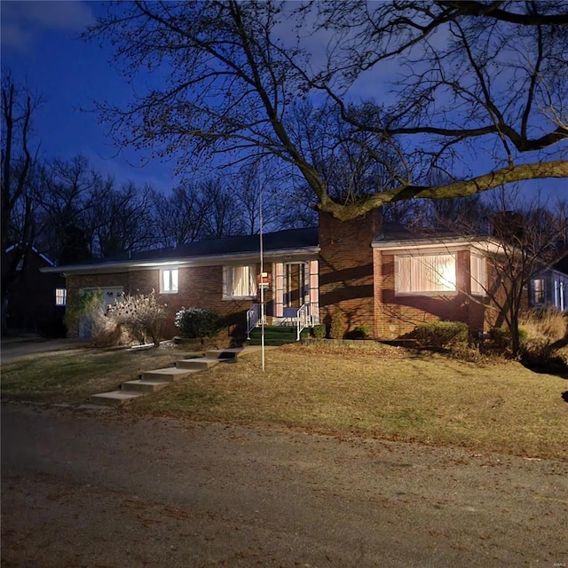 view of front of property featuring brick siding