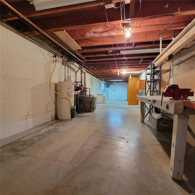 unfinished basement with gas water heater