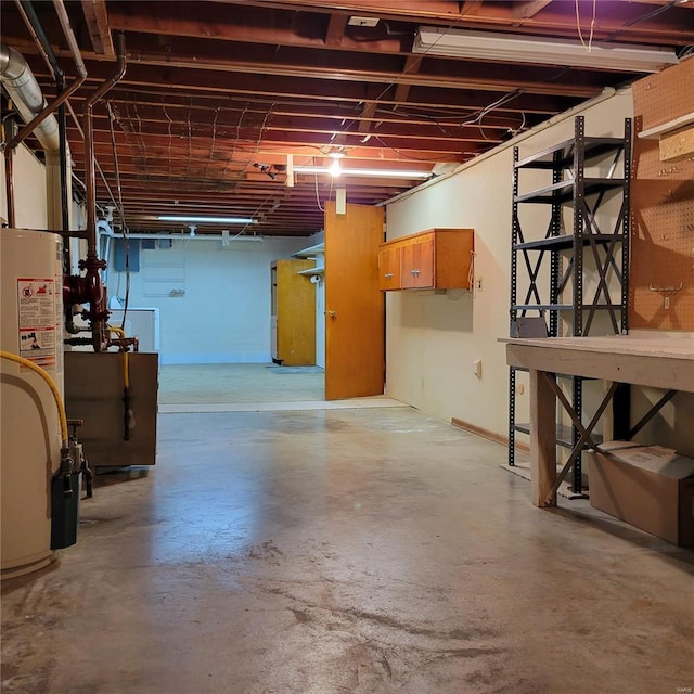 unfinished basement with gas water heater