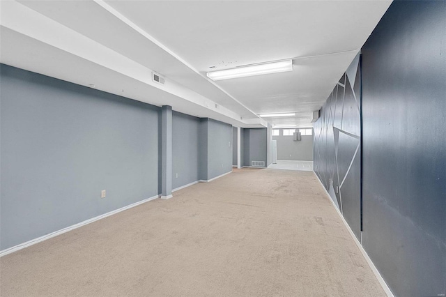 basement with light colored carpet