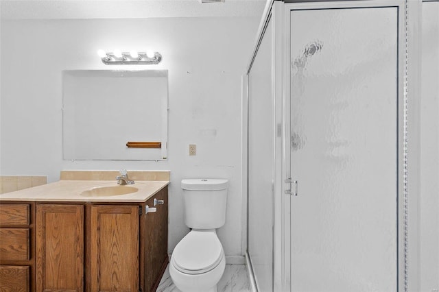 bathroom with vanity, toilet, and walk in shower