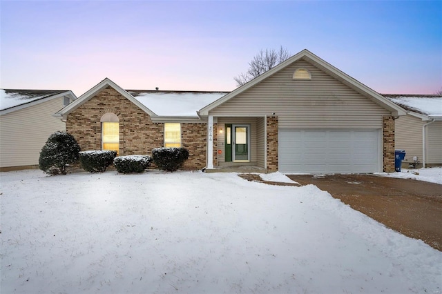 single story home featuring a garage