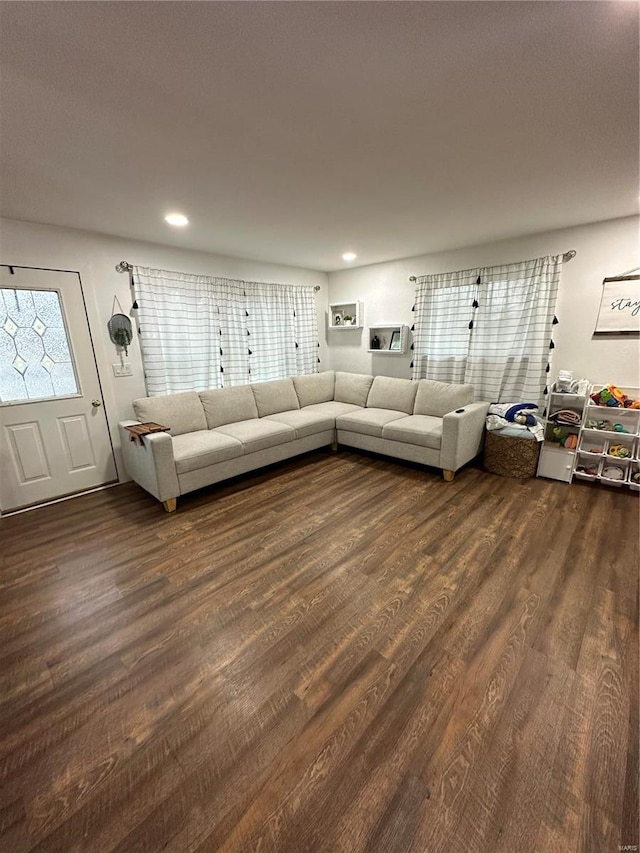 unfurnished living room with dark hardwood / wood-style floors