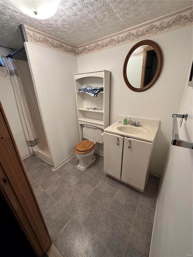 bathroom featuring vanity, toilet, and a shower with shower curtain