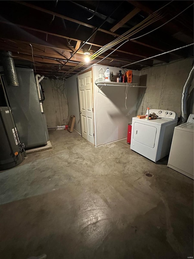 basement with washing machine and clothes dryer