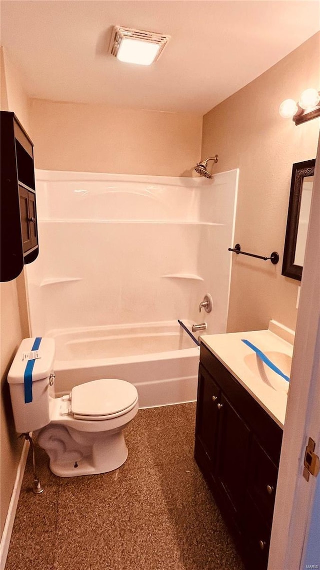 full bathroom featuring vanity, toilet, and  shower combination