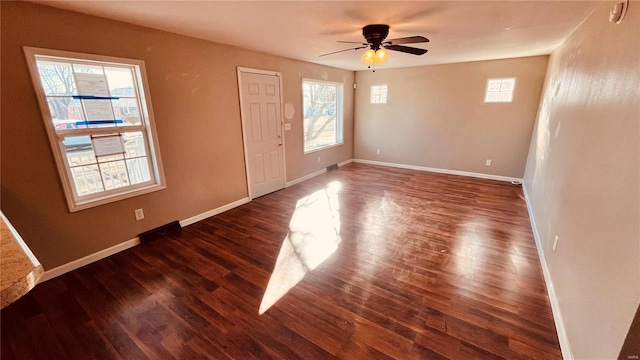 empty room with dark hardwood / wood-style floors and ceiling fan