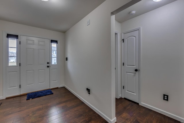 entryway with dark wood-type flooring