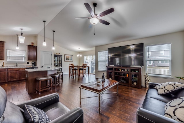 living room featuring vaulted ceiling, dark wood-type flooring, sink, and ceiling fan