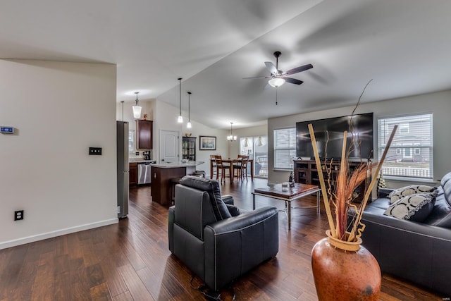 living room with dark hardwood / wood-style flooring, ceiling fan with notable chandelier, and vaulted ceiling