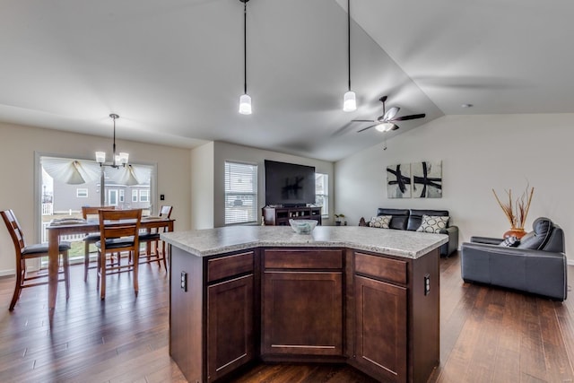 kitchen with dark brown cabinetry, hanging light fixtures, dark wood-type flooring, and a center island