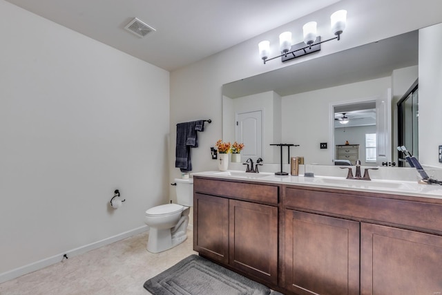 bathroom with vanity, ceiling fan, and toilet