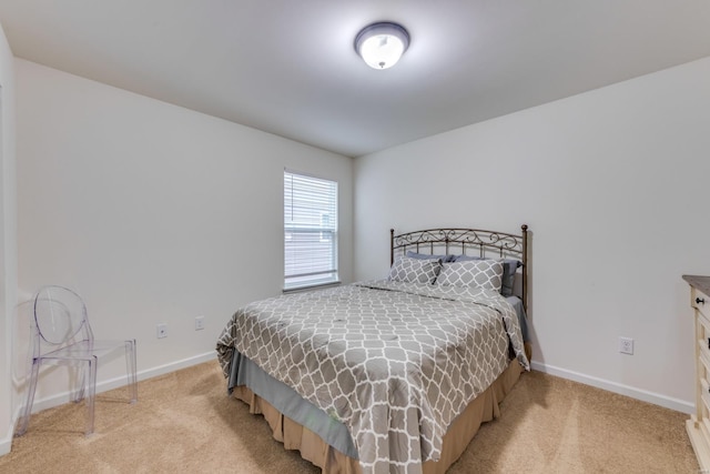 bedroom with light colored carpet