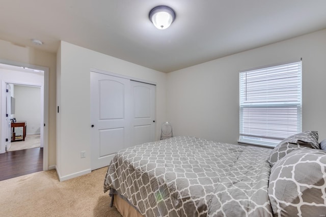 carpeted bedroom featuring a closet