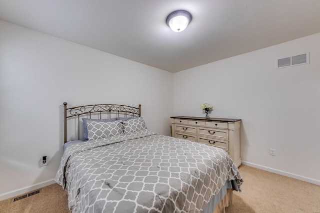 bedroom featuring light carpet