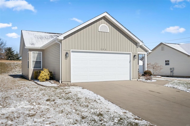 exterior space featuring an attached garage and concrete driveway