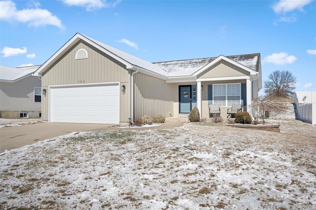 ranch-style house with concrete driveway, covered porch, and a garage