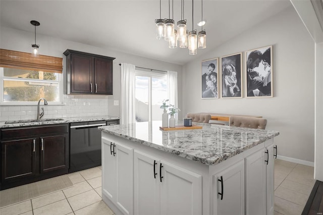 kitchen featuring a sink, decorative backsplash, light tile patterned flooring, and dishwasher