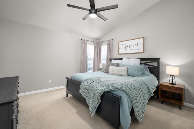 bedroom featuring a ceiling fan, baseboards, light colored carpet, and vaulted ceiling