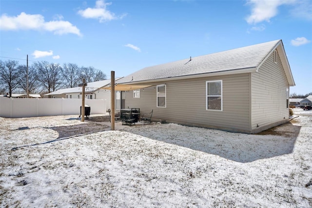 back of house with a patio and fence