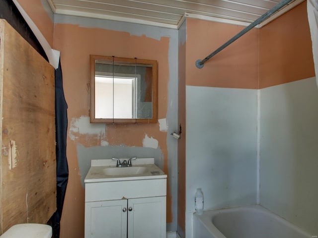 bathroom with vanity and a tub to relax in