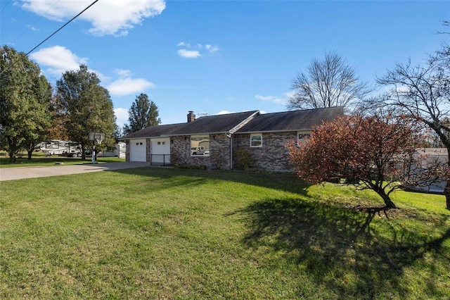 view of front of property with a garage and a front lawn