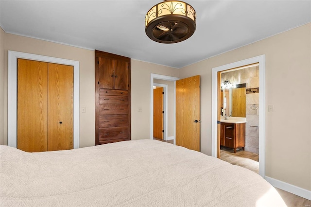 bedroom featuring ensuite bath