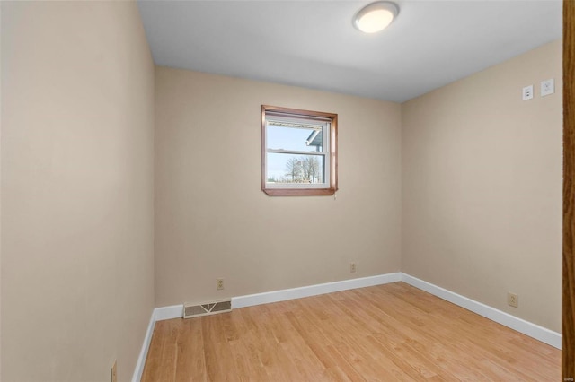 unfurnished room with light hardwood / wood-style floors