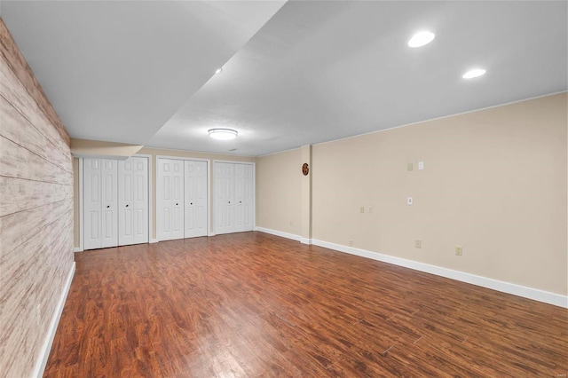 basement with hardwood / wood-style floors