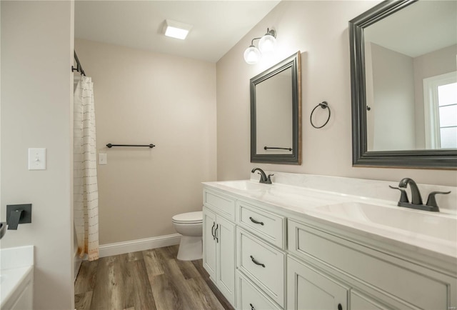 full bathroom featuring vanity, shower with separate bathtub, hardwood / wood-style floors, and toilet