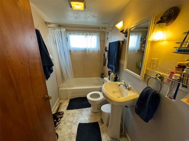 full bathroom with a textured ceiling, sink, toilet, and shower / bath combination with curtain