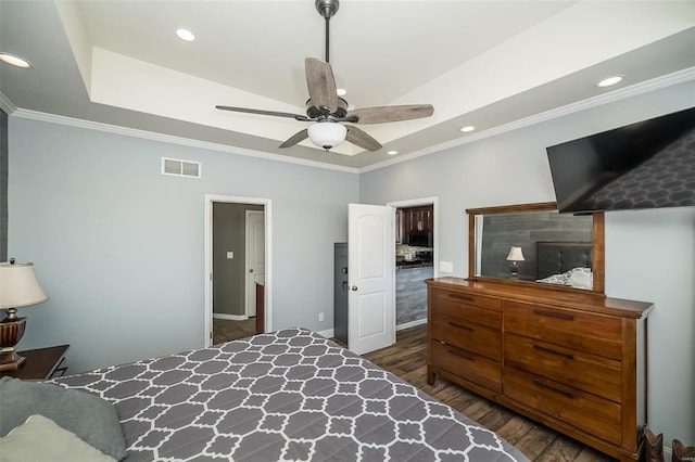 bedroom featuring dark wood-type flooring, recessed lighting, visible vents, and crown molding