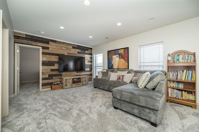 living room with carpet floors, wood walls, and recessed lighting